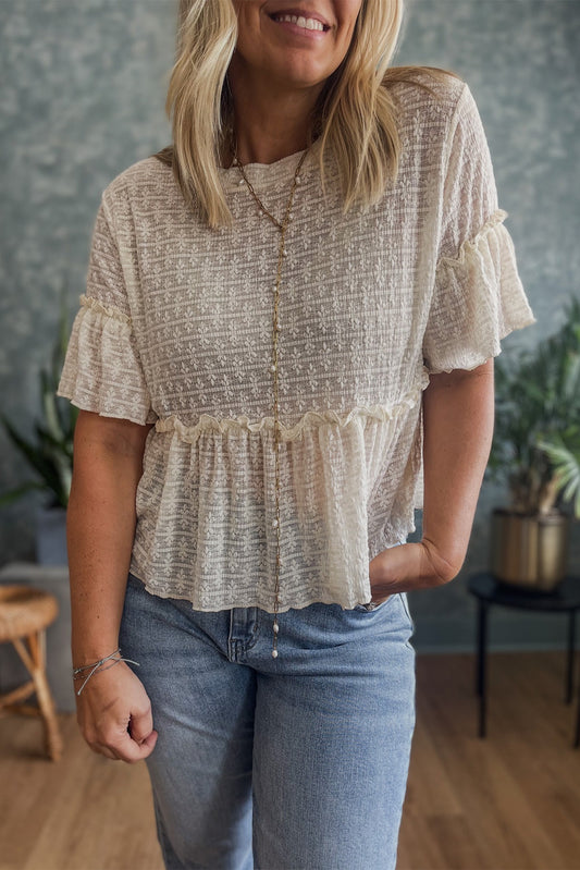 Beige einfarbige Bluse mit Spitzenstruktur und Rüschen