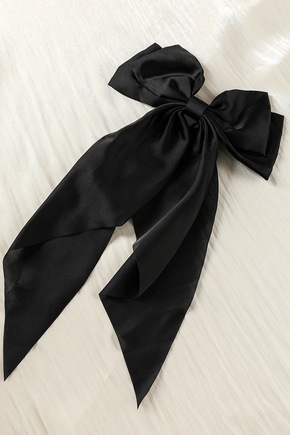 Schwarze, elegante, übergroße Haarspange aus Satin mit Schleife