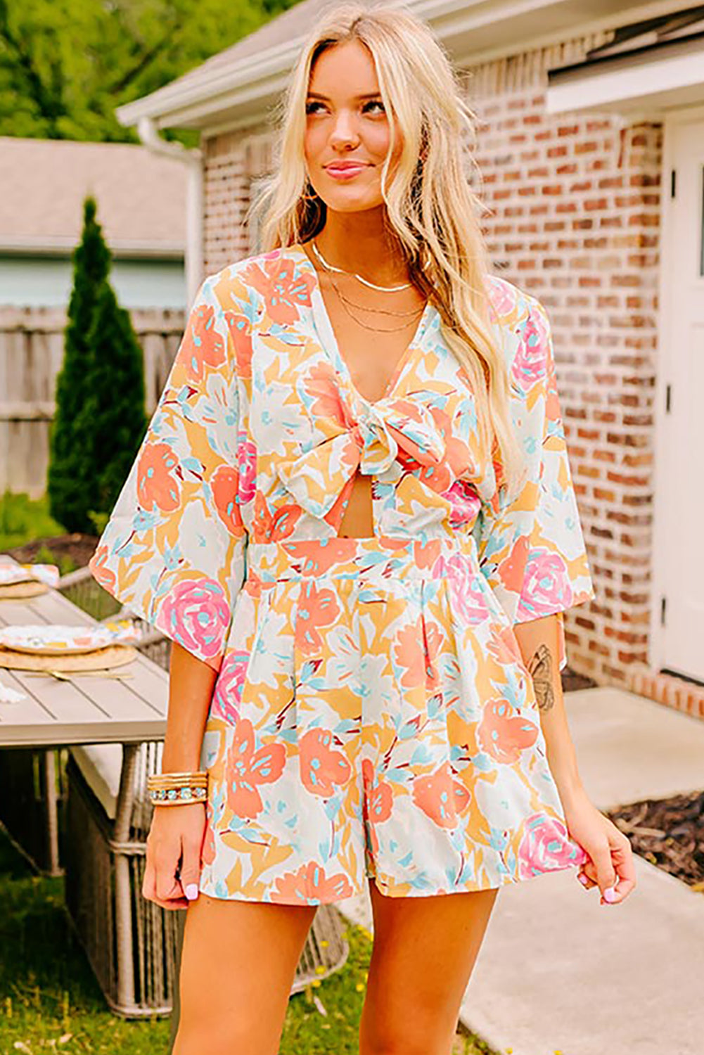 Orange Floral Print Front Tie V Neck Romper - MAD RUFFI